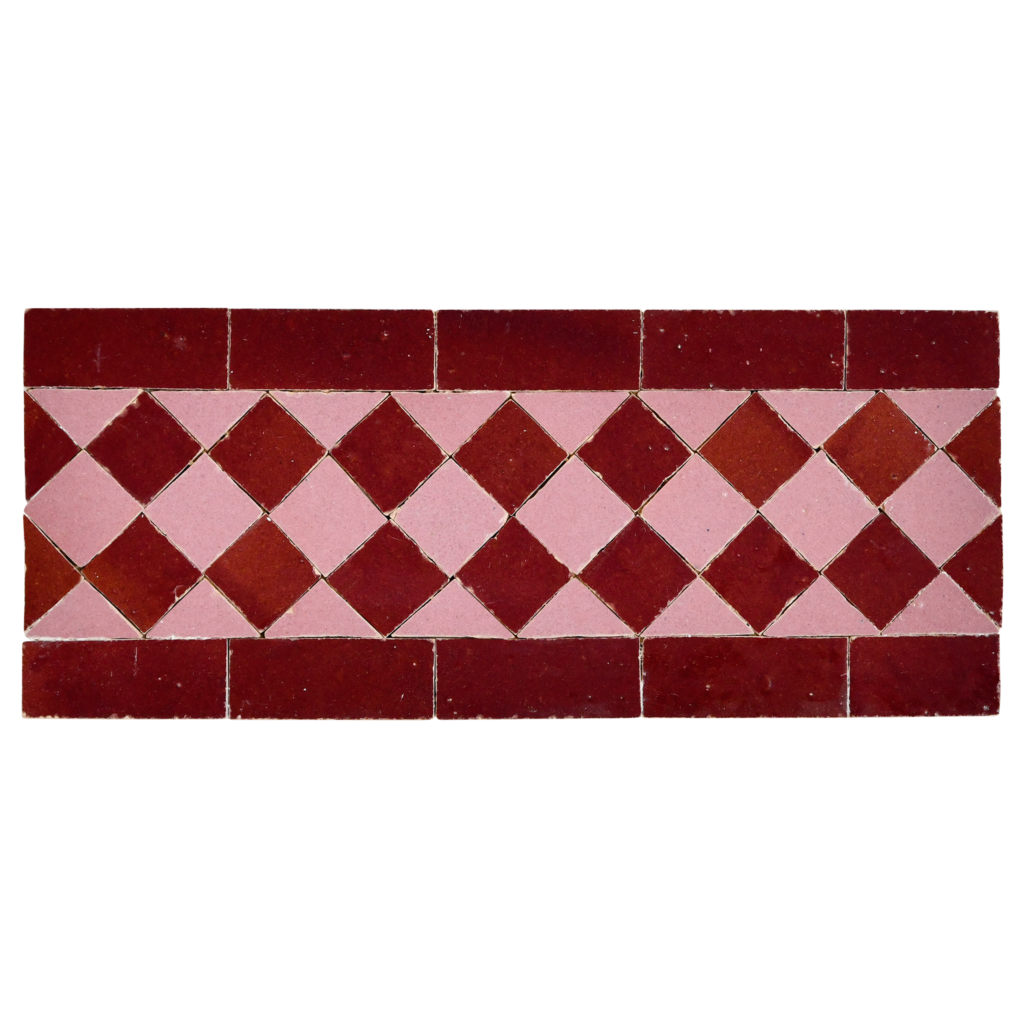 Patterned tile with red and pink diamond design on a white background
