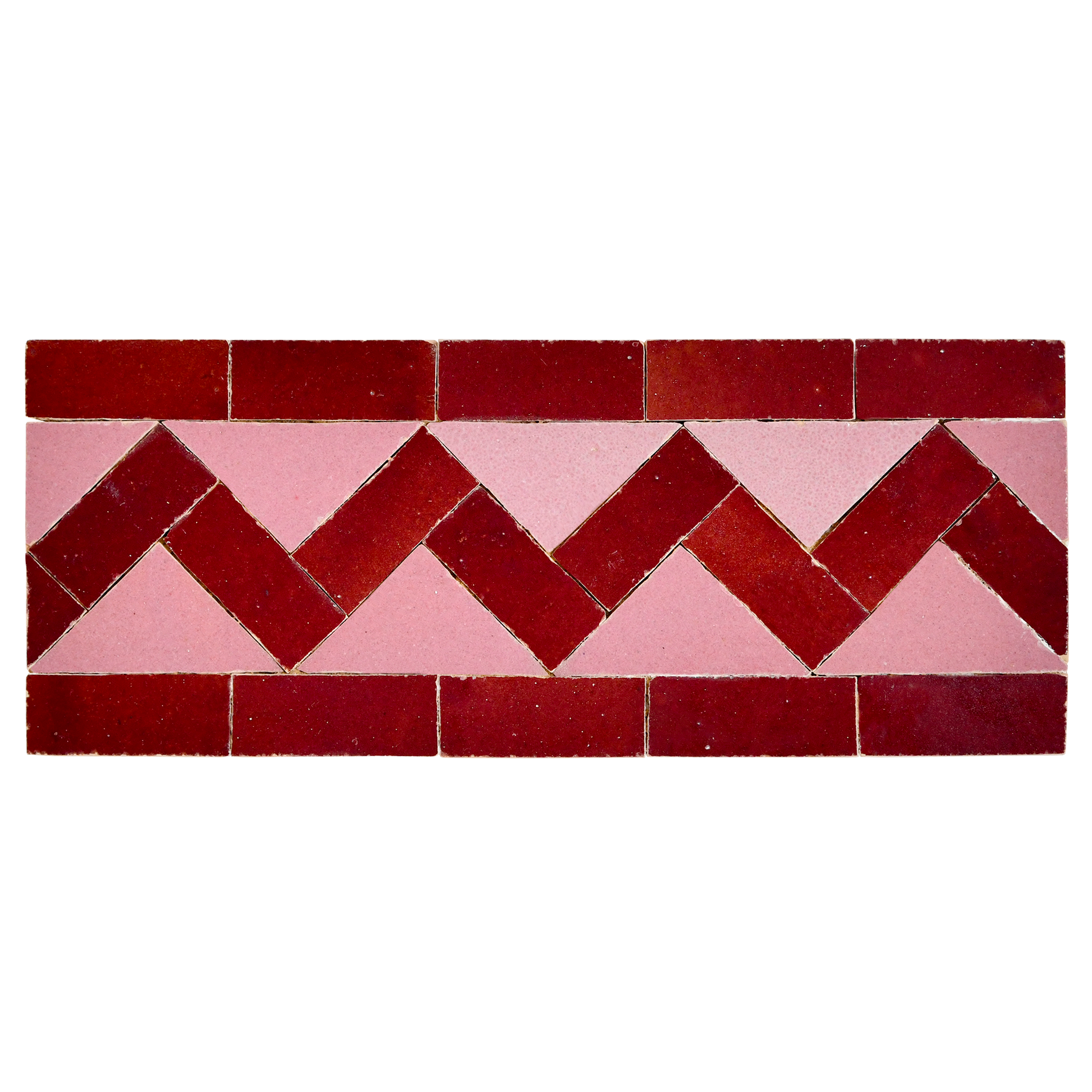 Tiled pattern with red and pink chevron design on a white background