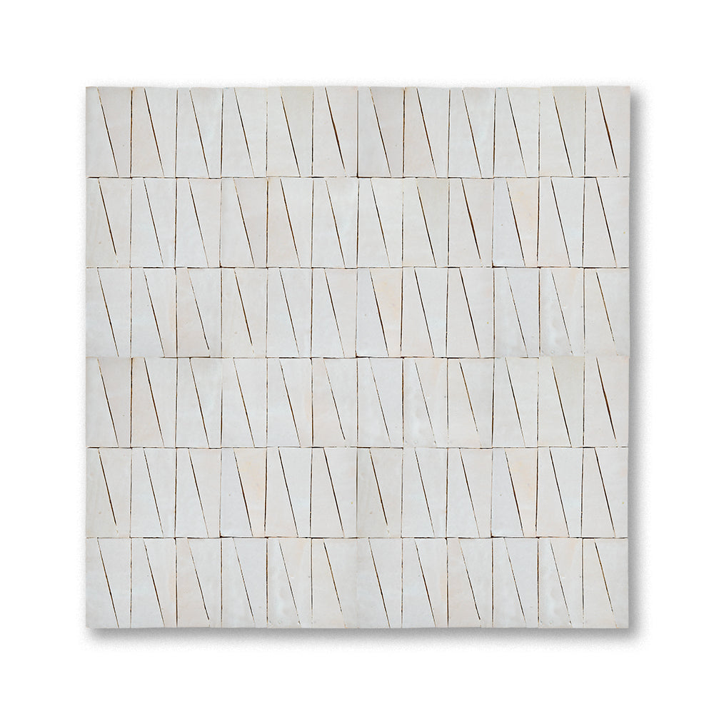 Cream zellige mosaic installed in a geometric trapezoid pattern