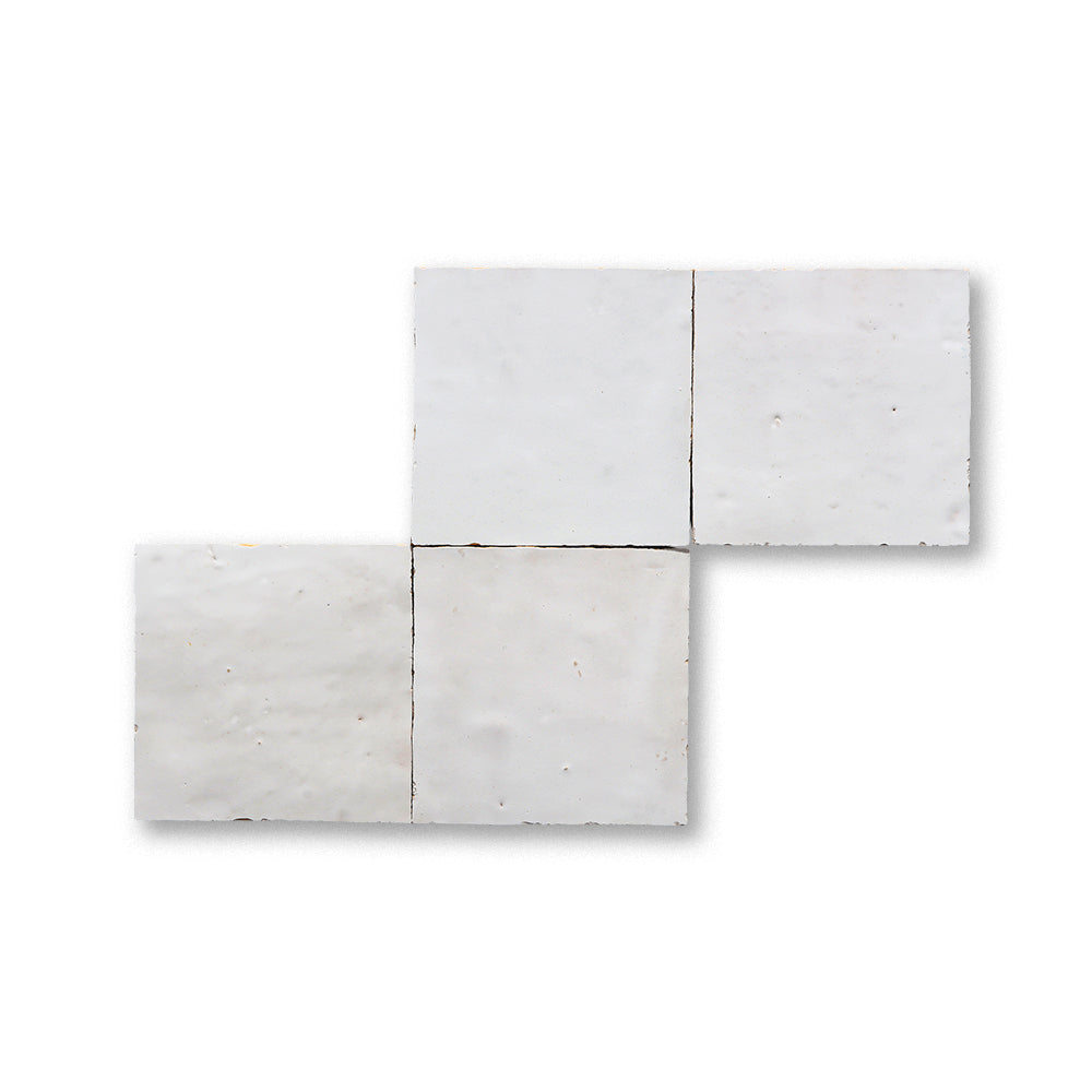 Set of three square concrete tiles on a white background