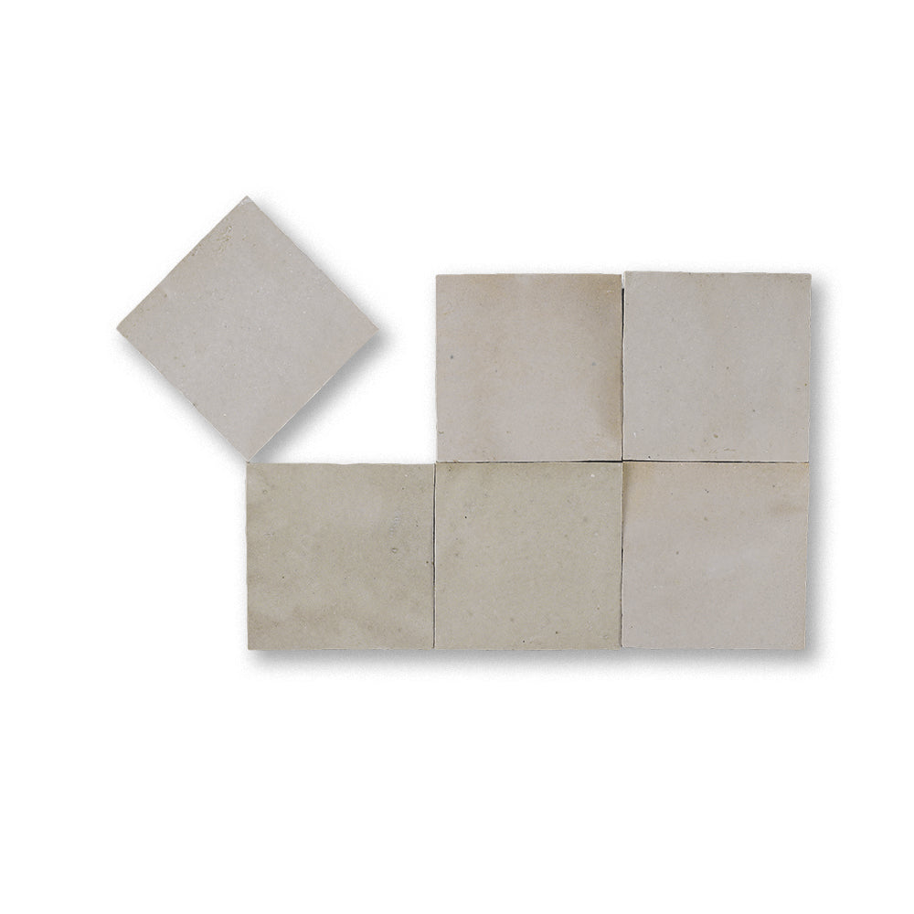 Set of square tiles in beige color on a white background