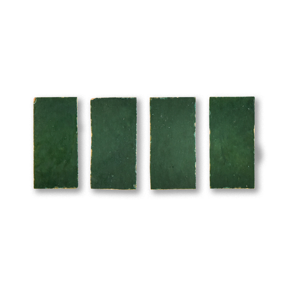 Four green rectangular tiles on a white background