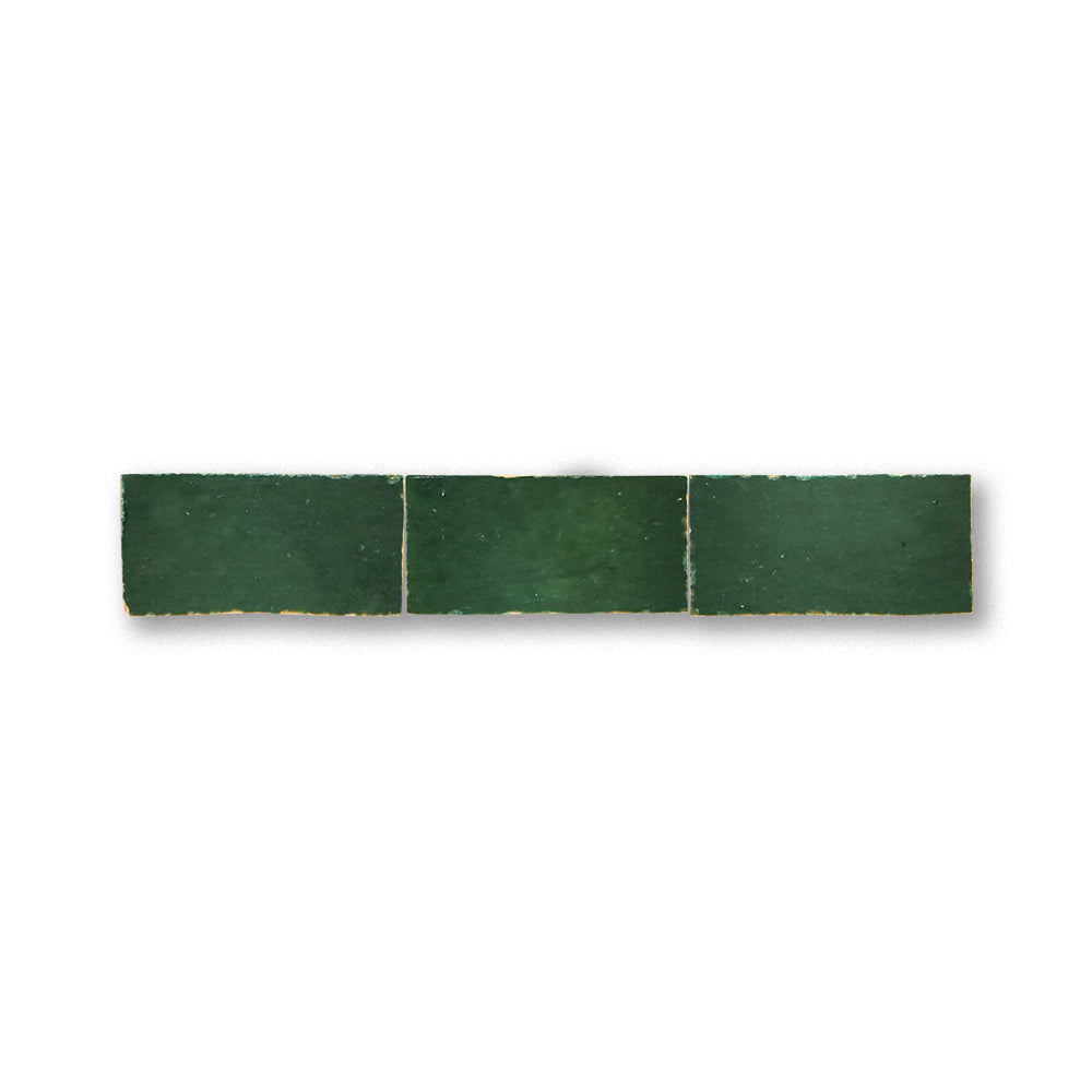 Green ceramic tile strip on a white background