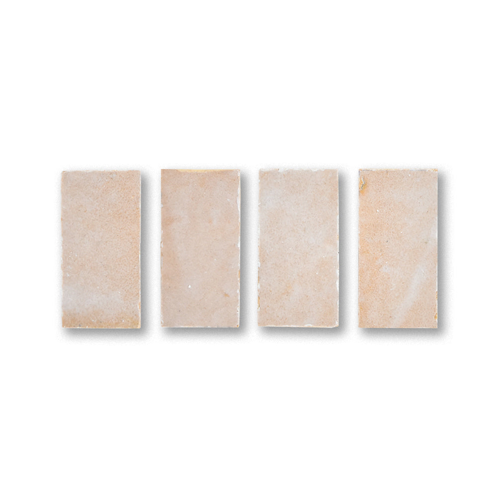 Four beige rectangular tiles on a white background