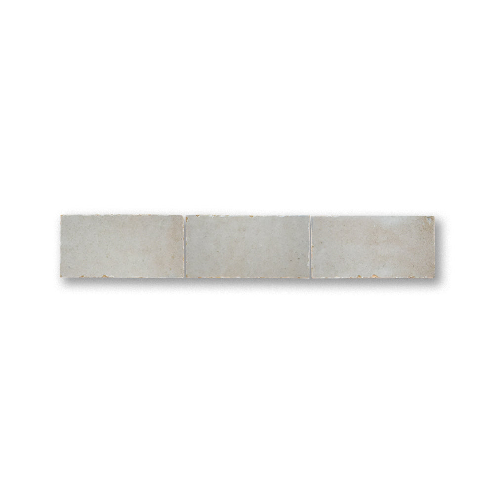Long rectangular tile with a textured surface on a white background