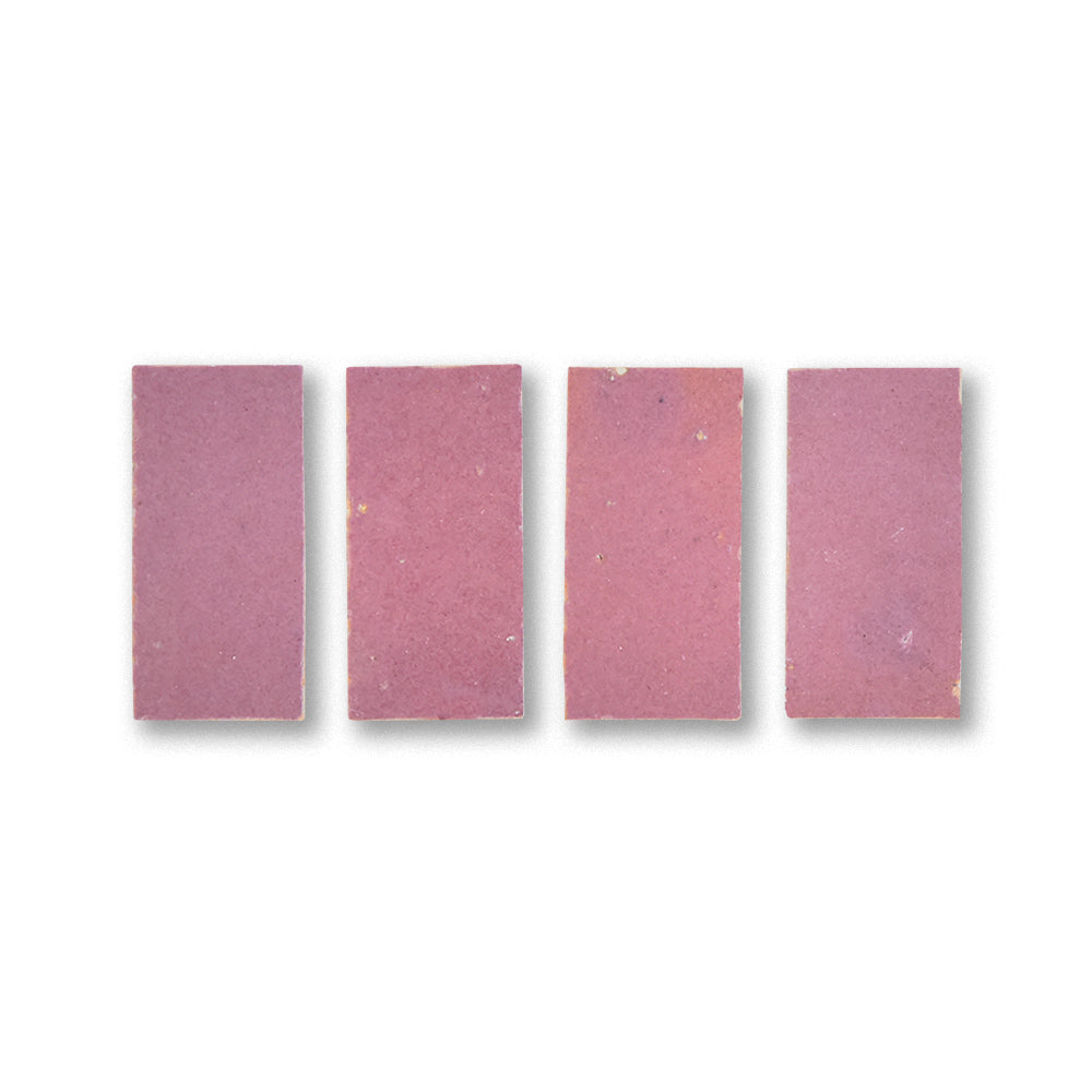 Five pink rectangular tablets arranged in a row on a white background