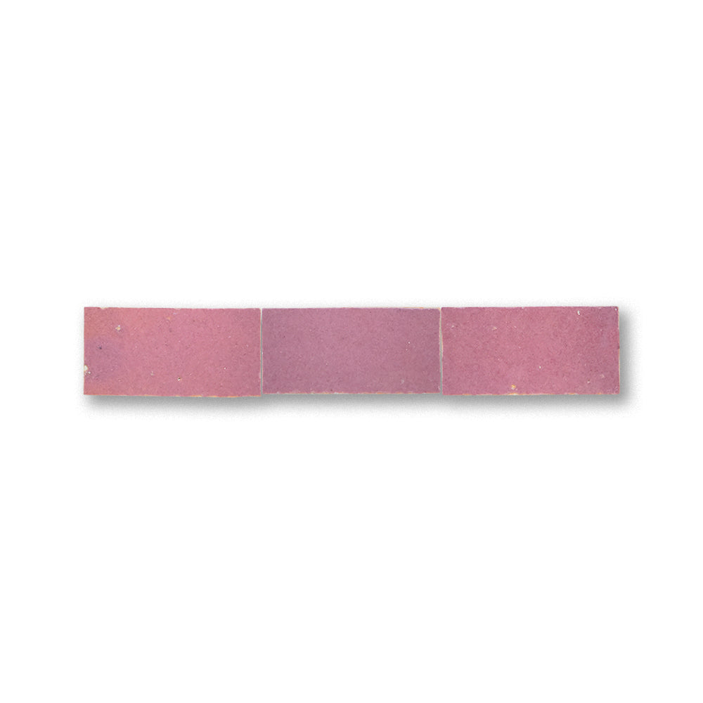 Rectangular pink tile on a white background