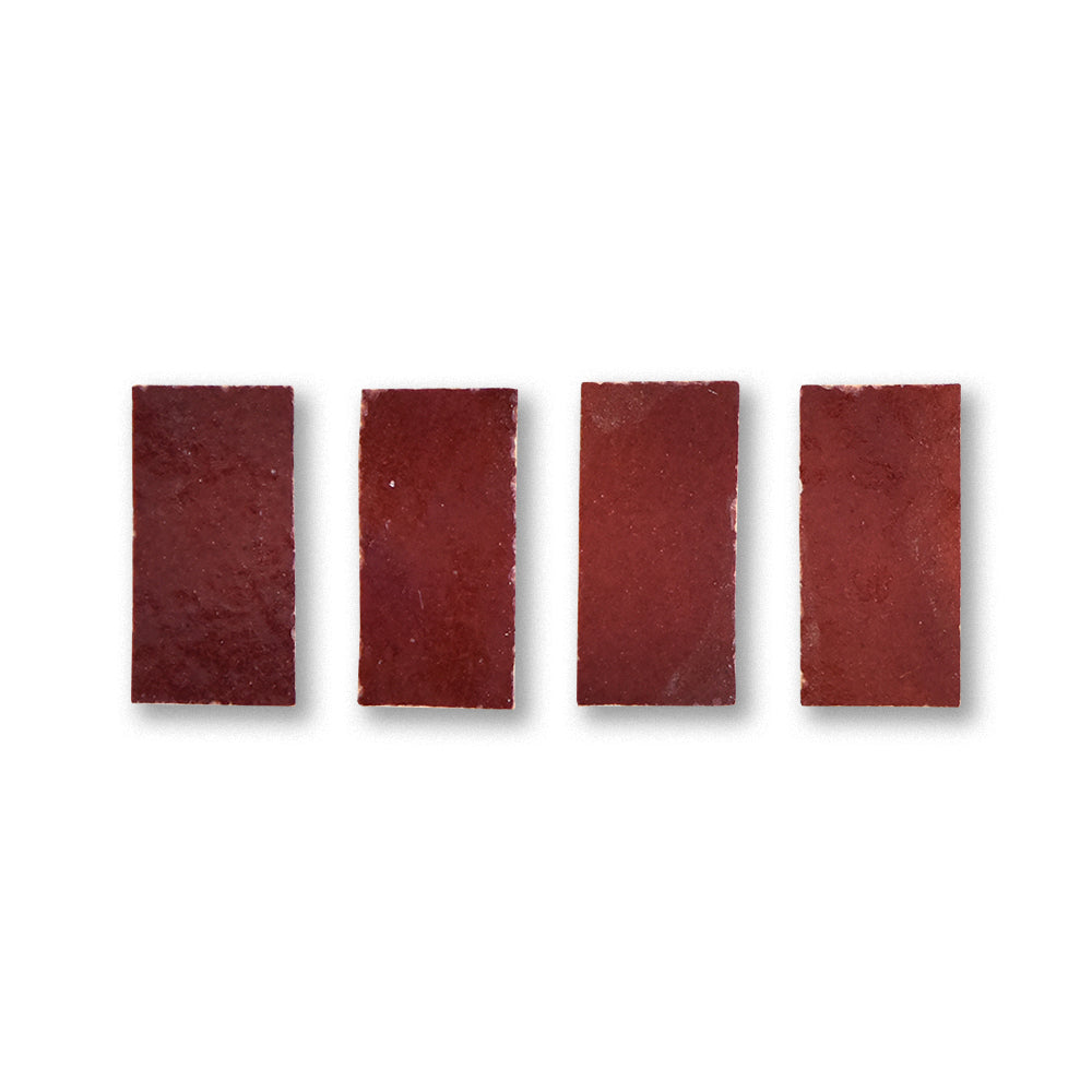 Four rectangular red sandpaper sheets on a white background