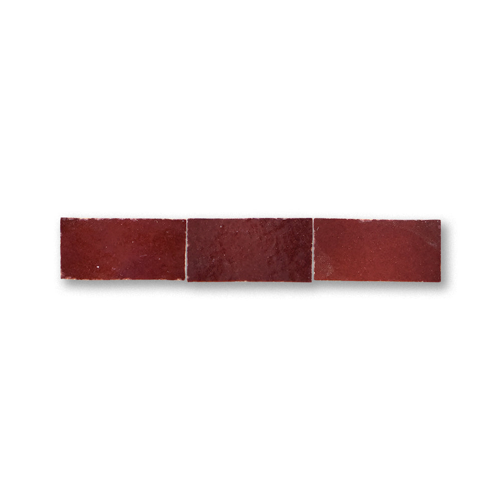 Three red tiles arranged horizontally on a white background