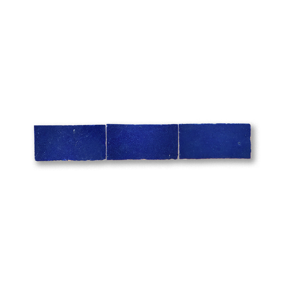 Three blue rectangular tiles on a white background