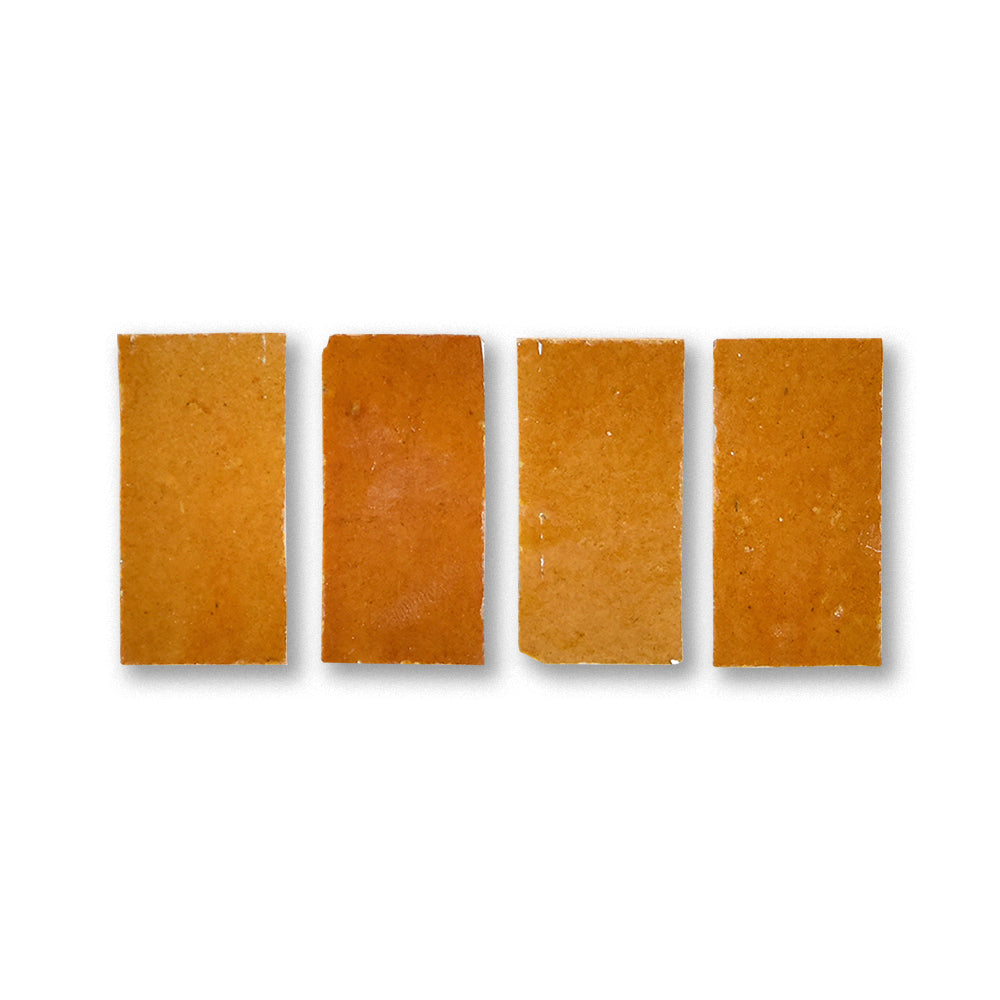 Four rectangular brown soap bars on a white background