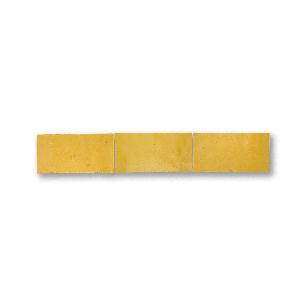 Three yellow tiles arranged horizontally on a white background