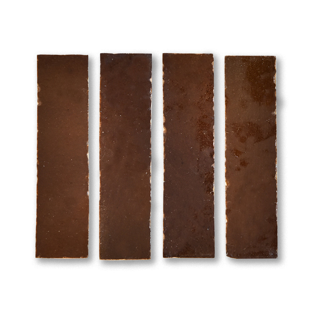 Four dark chocolate bars arranged in a row on a white background