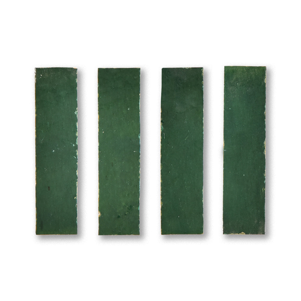 Four rectangular green bars of soap on a white background