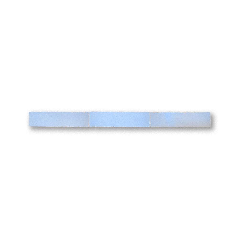 Rectangular light blue bar with metallic accents on a white background