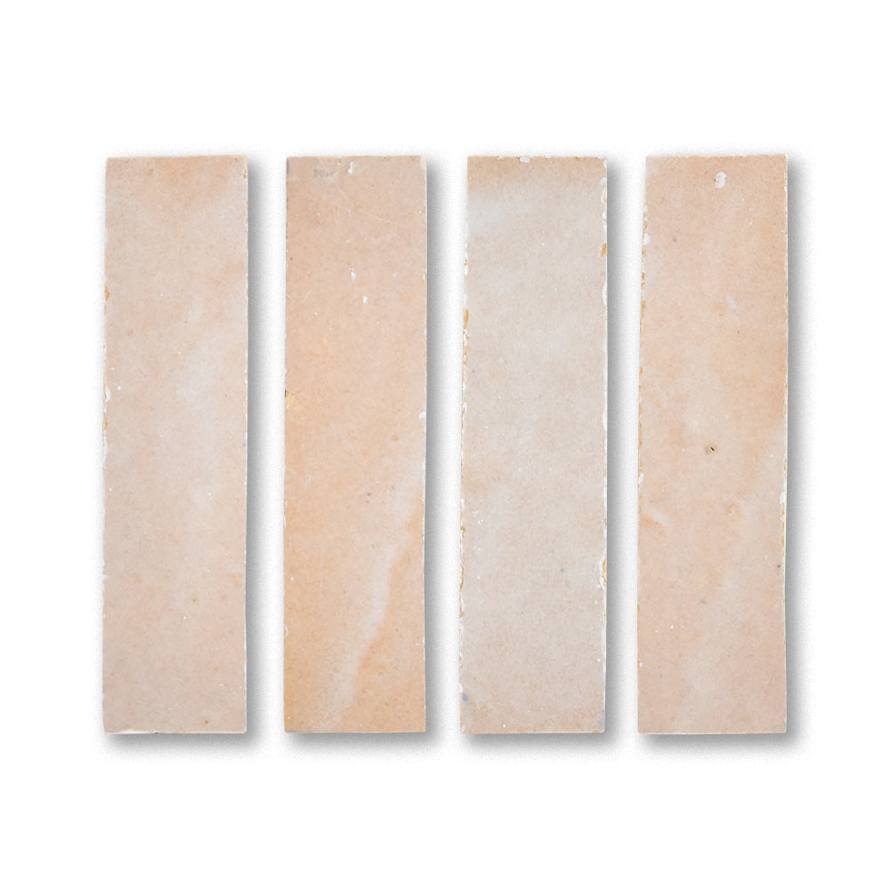 Four beige marble tiles on a white background