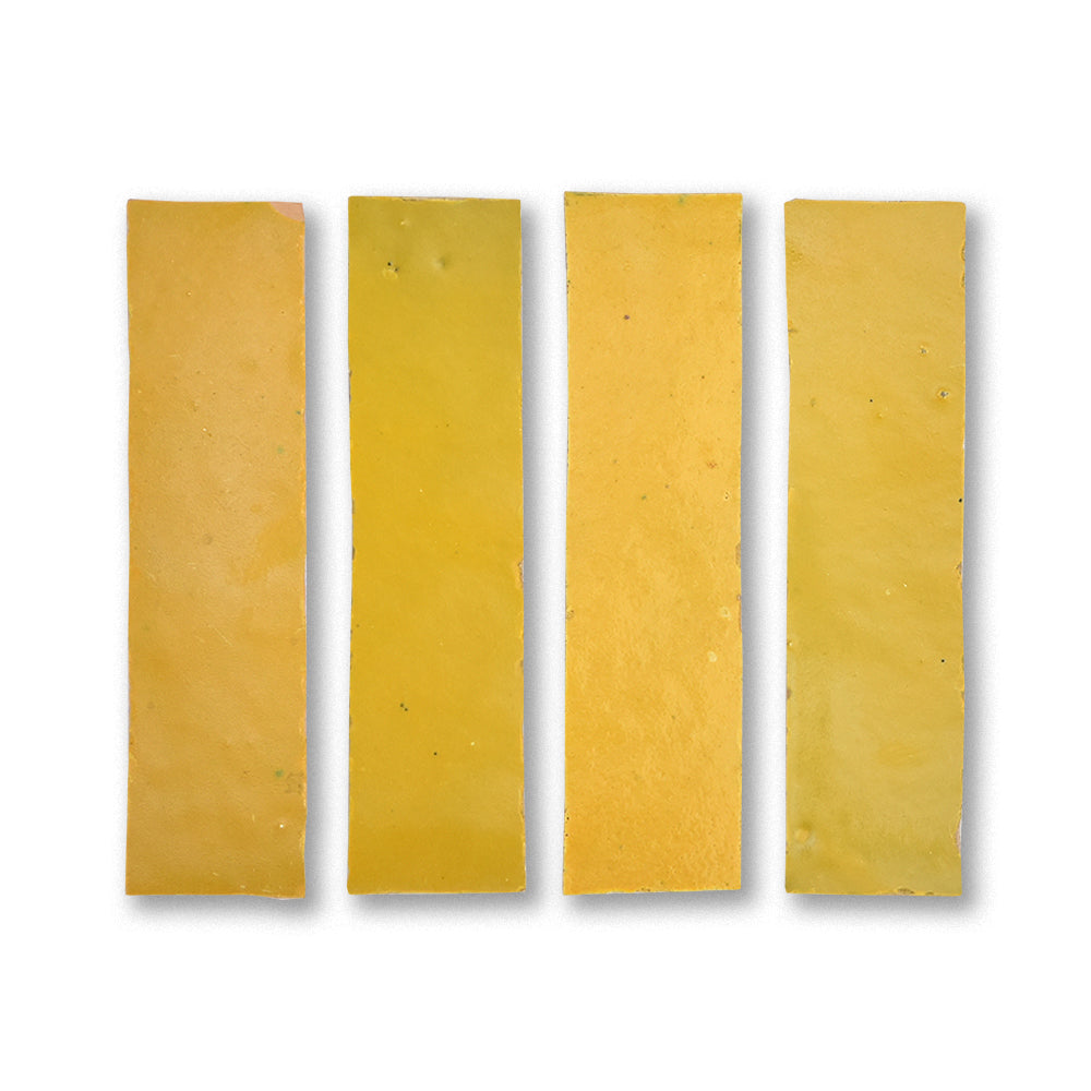 Four rectangular yellow cheese slices on a white background